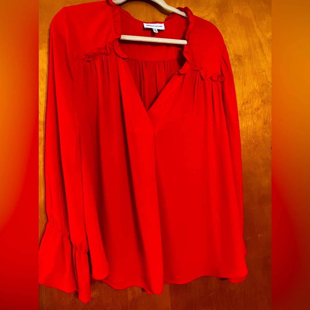 Ruffle detail blouse.